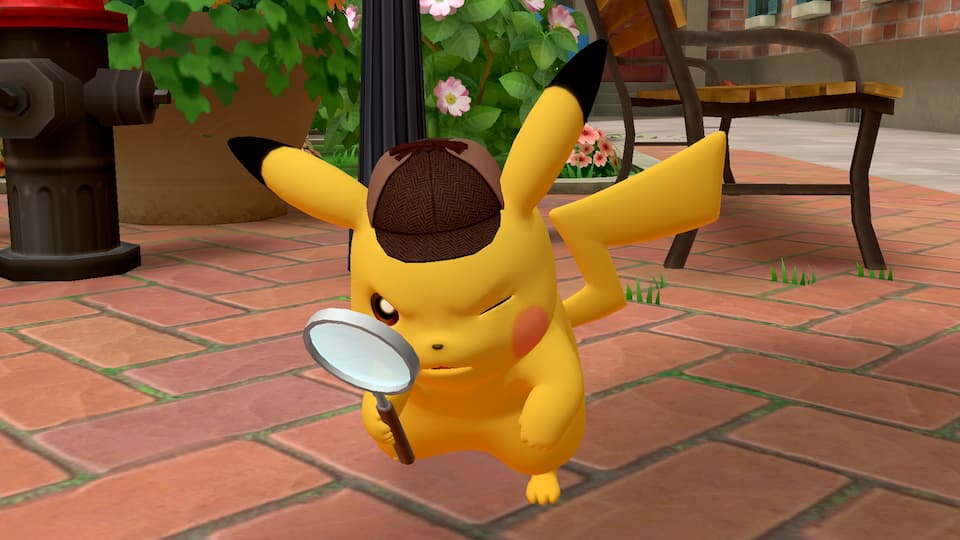 Detective Pikachu che guarda attraverso una lente d'ingrandimento.